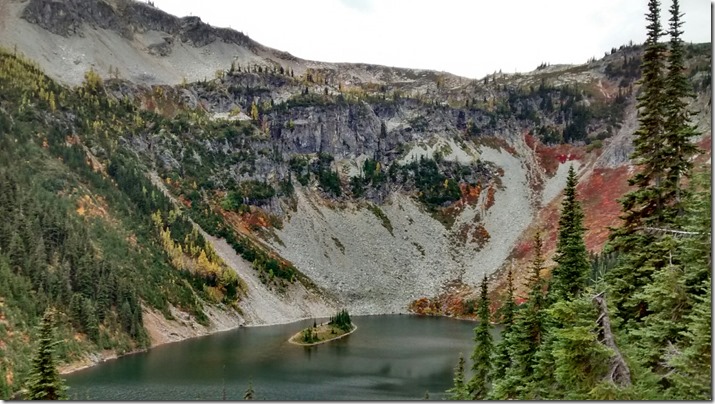 Fall colors and the hillside surround Lake Ann on the Maple Pass Loop Trail